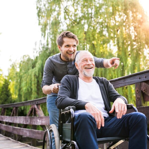 guy outside happy in wheelchair