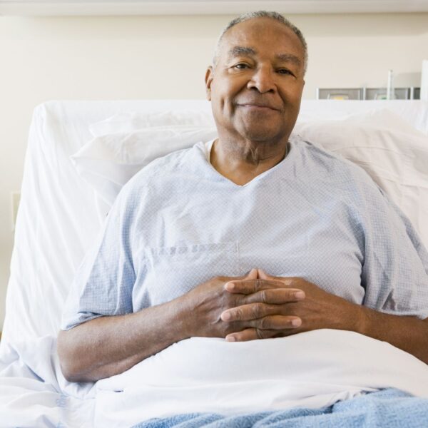 man in hospital bed