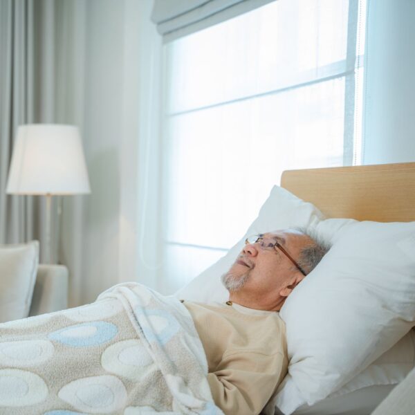 elderly man in hospital bed