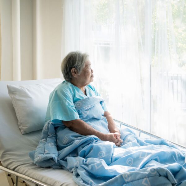 woman sitting in a hospital bed