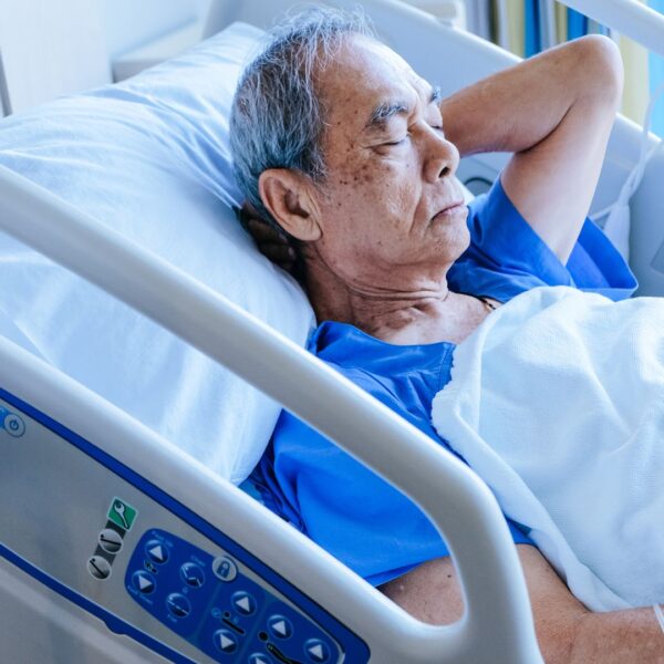 elderly man in a hospital bed