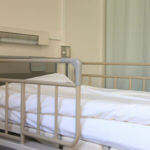 Railings on hospital beds for enhanced safety.