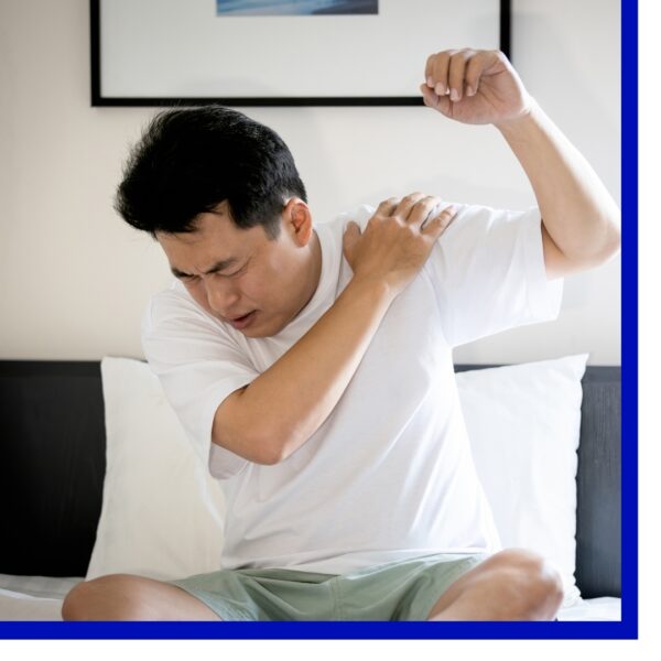Man holding his shoulder