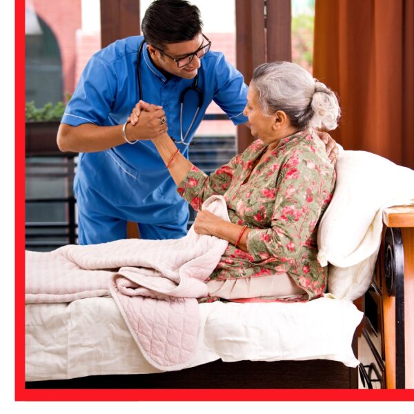 Man holding hand of woman in hospital bed