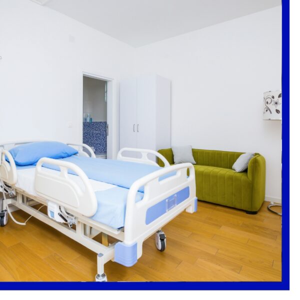 Empty hospital bed in a room