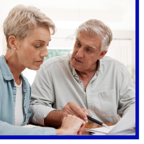 image of seniors looking at paperwork