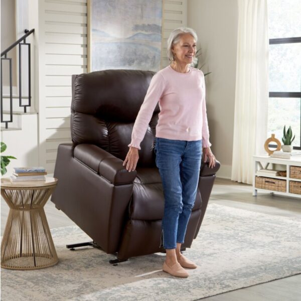 image of a woman standing up in a lift chair
