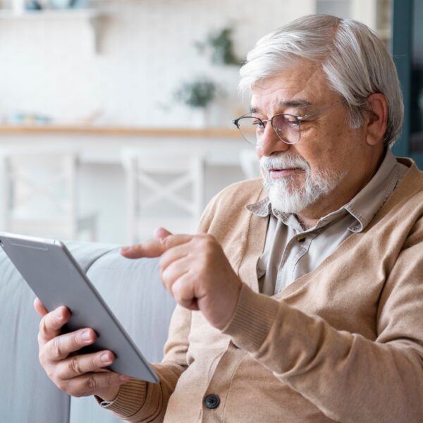 image of an older man researching on an iPad