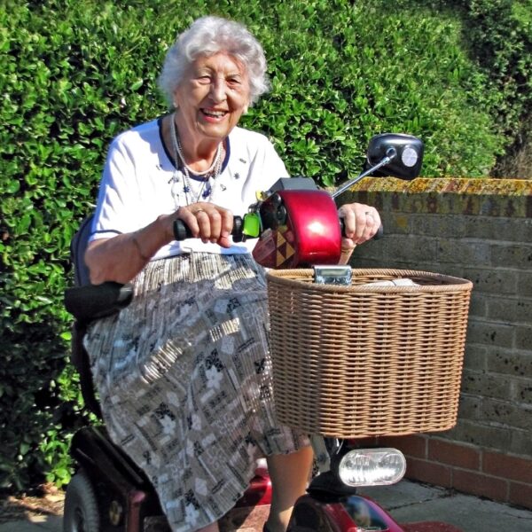 Old lady using a mobility scooter