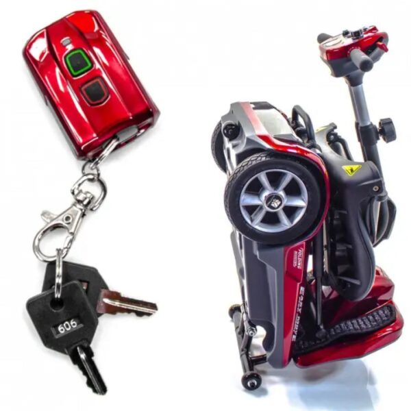 A folded mobility scooter and its keys