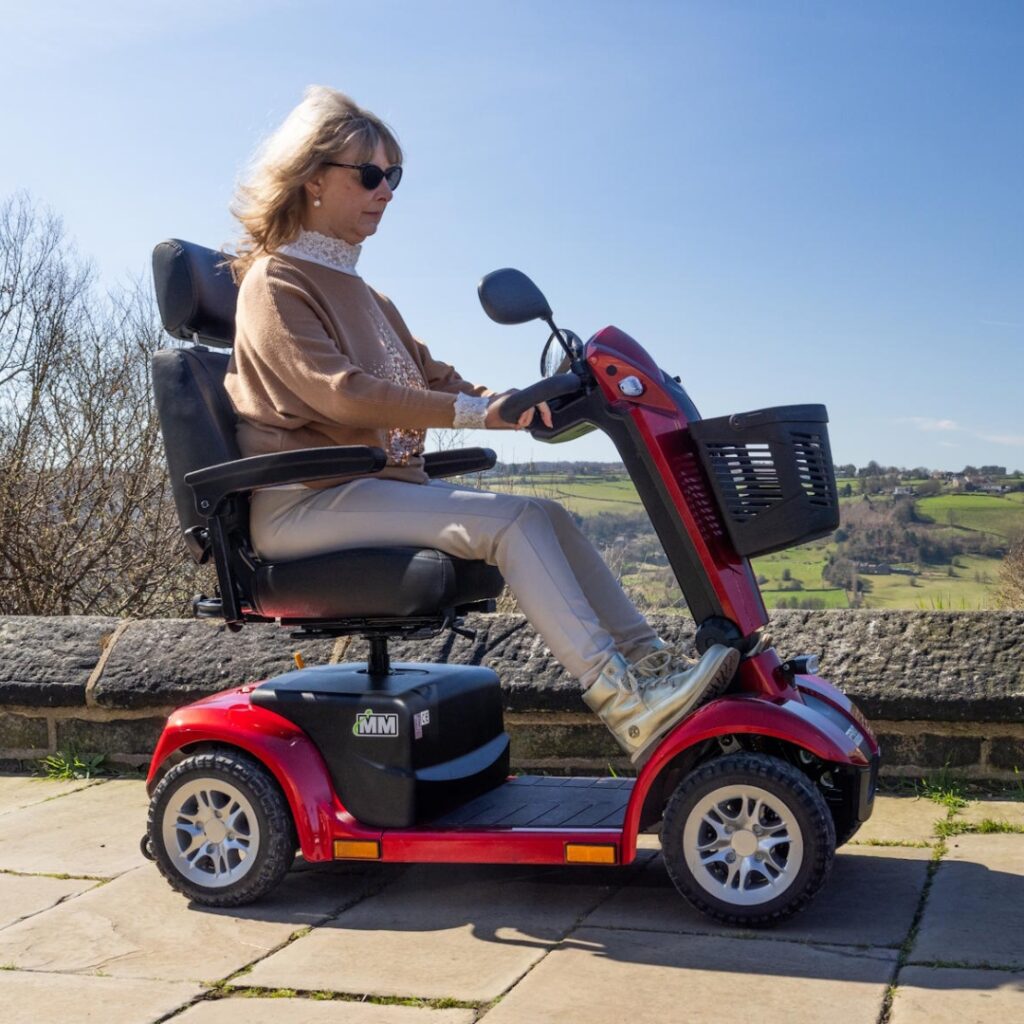woman riding a power mobility scooter