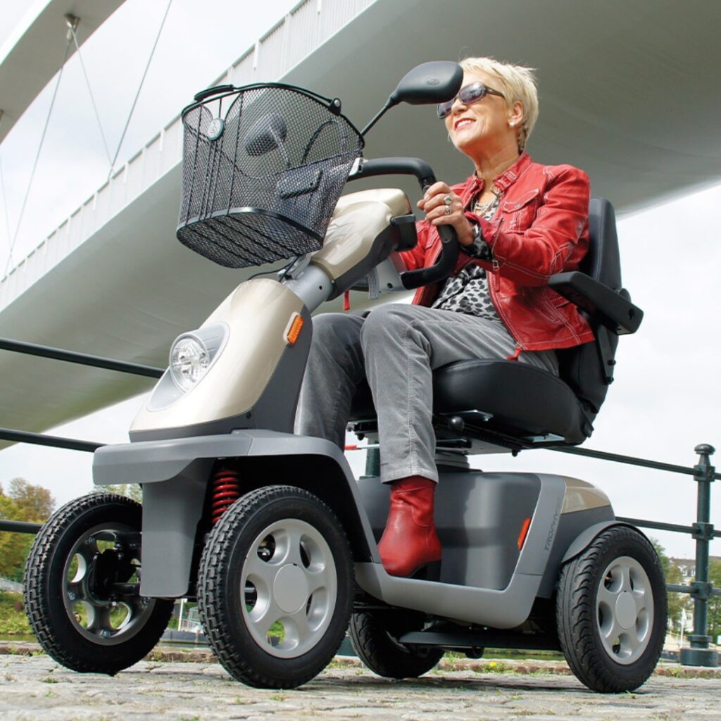 woman riding a power mobility scooter