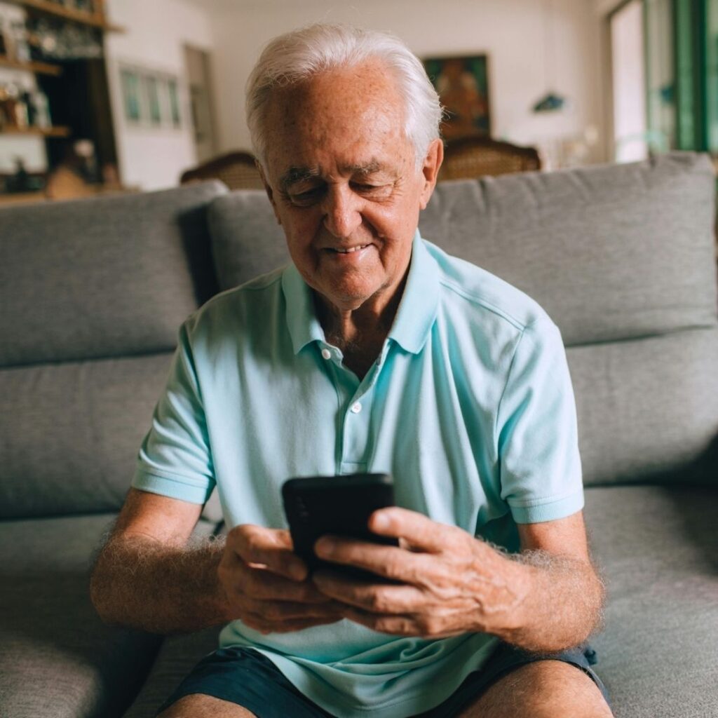 An old man texting