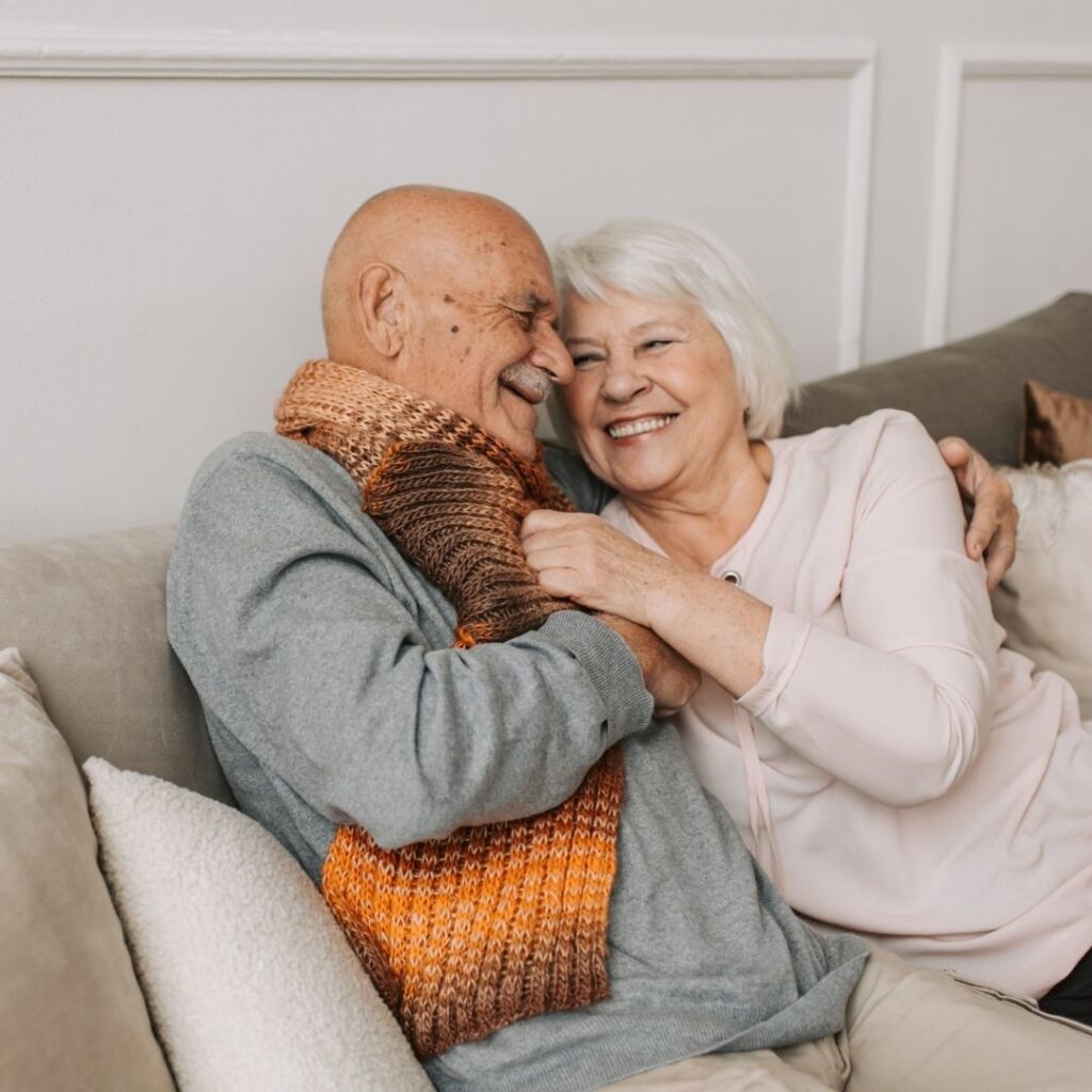 An older couple cuddling
